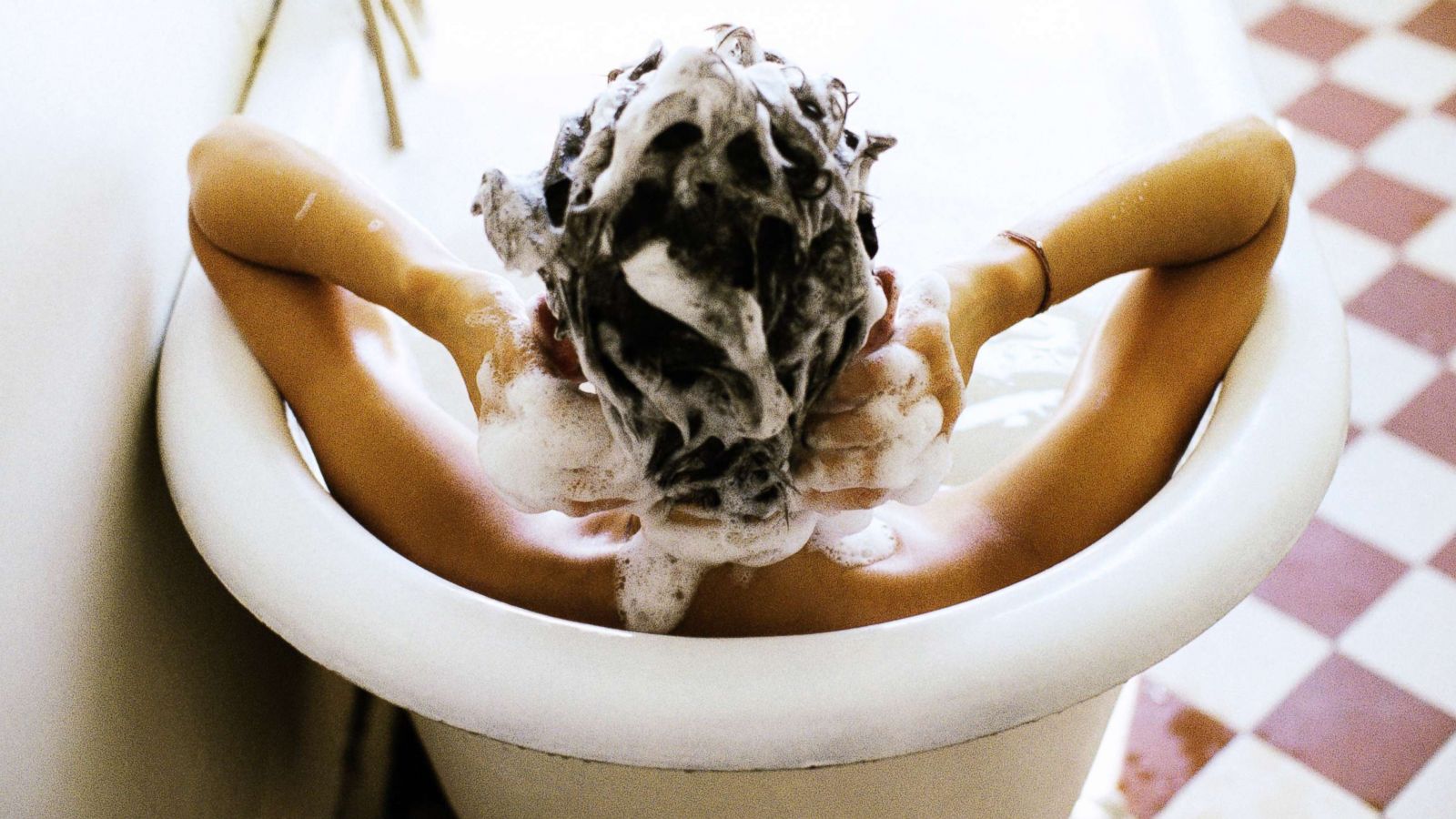 PHOTO: A woman washes her hair.