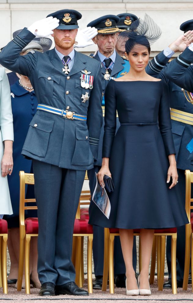 PHOTO: Prince Harry, Duke of Sussex and Meghan Markle, Duchess of Sussex attend a ceremony to mark the centenary of the Royal Air Force on the forecourt of Buckingham Palace, July 10, 2018 in London.