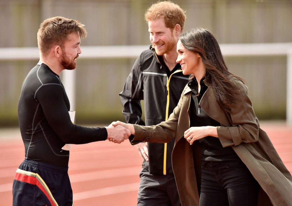 PHOTO: Britain's Prince Harry and Meghan Markle greet an athlete as they visit Bath University, in Bath, England, April 6, 2018, to view hopeful candidates for the UK Team Trial for the Invictus Games in Sydney in 2018.