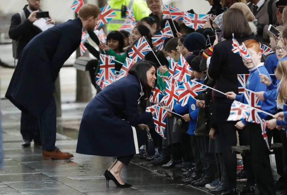 PHOTO: Britain's Prince Harry and Meghan Markle speak to school children as they arrive to take part in an event for young women as part of International Women's Day in Birmingham, central England, March 8, 2018.