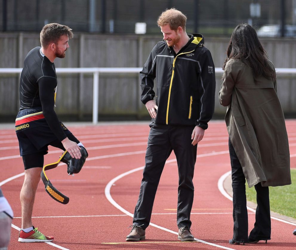 PHOTO: Britain's Prince Harry and Meghan Markle greet an athlete as they visit Bath University, in Bath, England, April 6, 2018, to view hopeful candidates for the UK Team Trial for the Invictus Games in Sydney in 2018.
