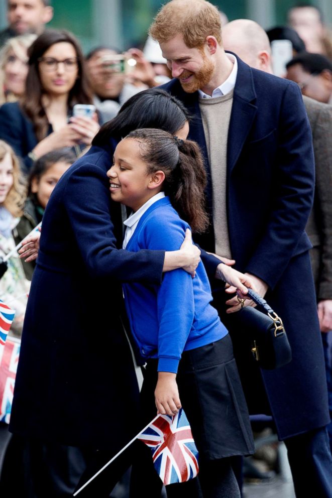 PHOTO: Britain's Prince Harry and Meghan Markle speak to school children as they arrive to take part in an event for young women as part of International Women's Day in Birmingham, central England, March 8, 2018.