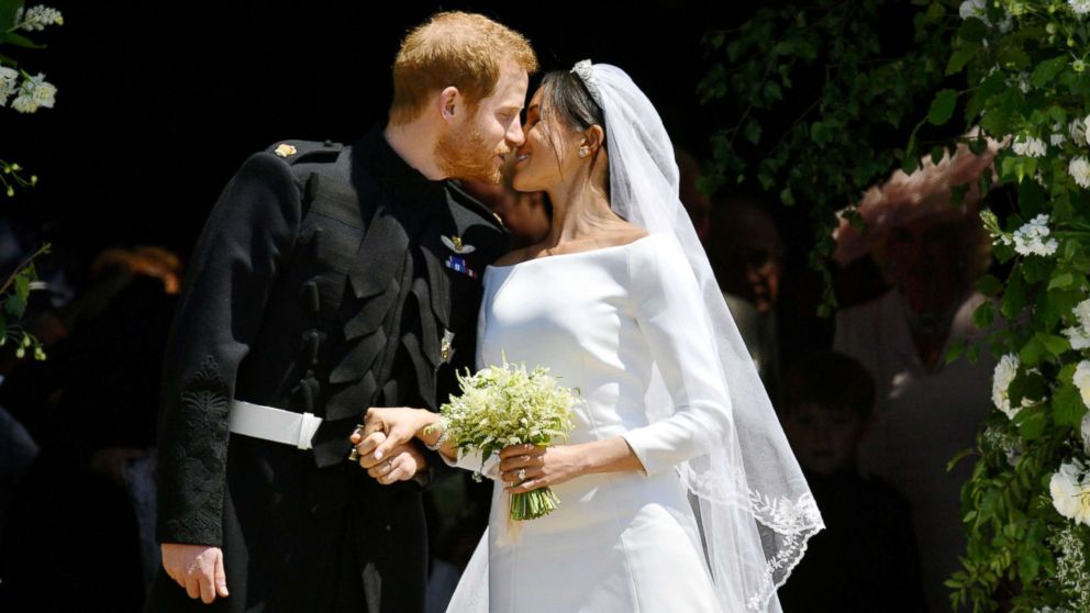 Prince Harry and Meghan Markle kiss on the steps of St George's Chapel in Windsor Castle after their wedding in Windsor, Britain, May 19, 2018.
