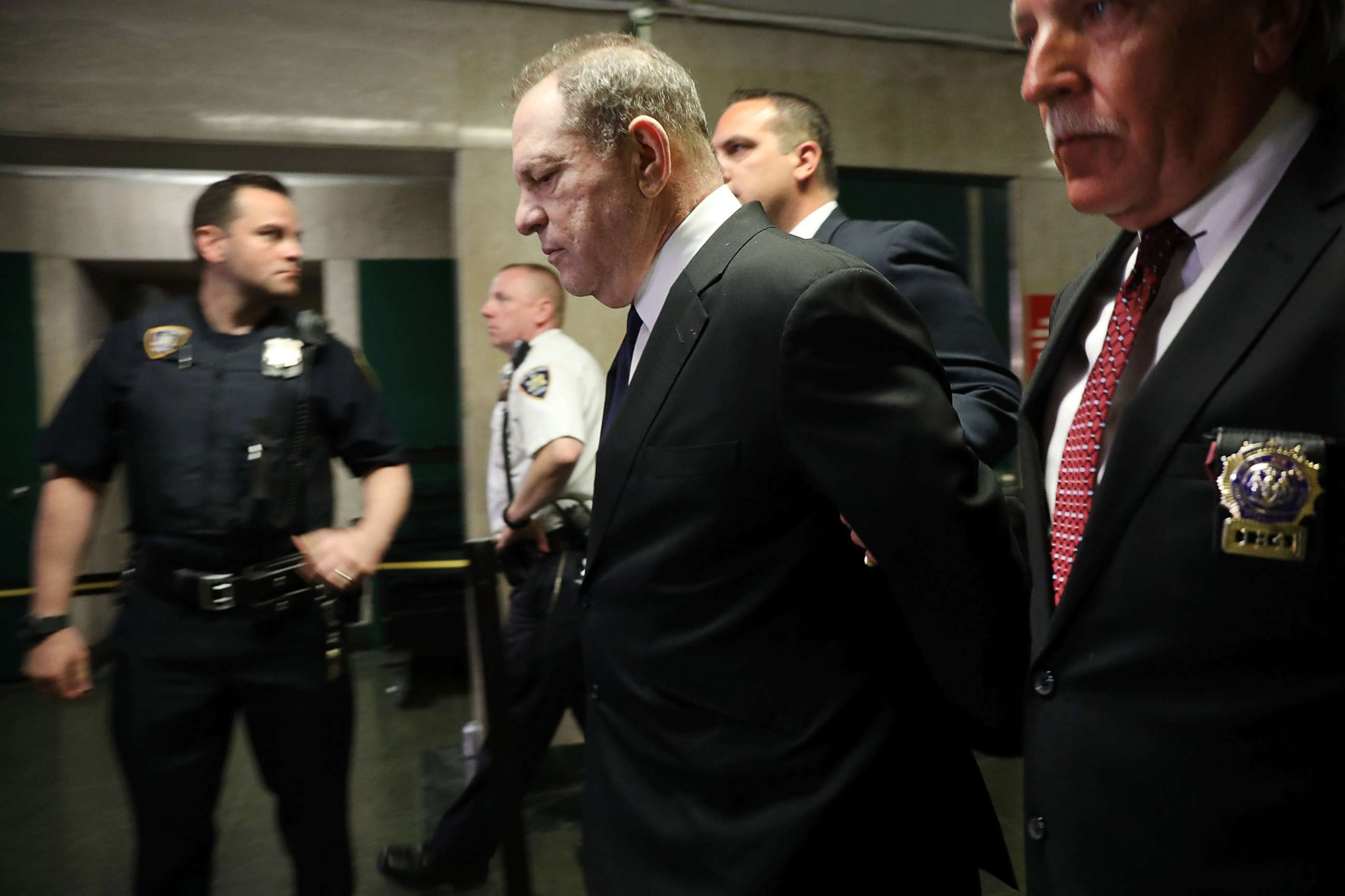 PHOTO: Harvey Weinstein is escorted in handcuffs into State Supreme Court for an arraignment July 9, 2018 in New York.