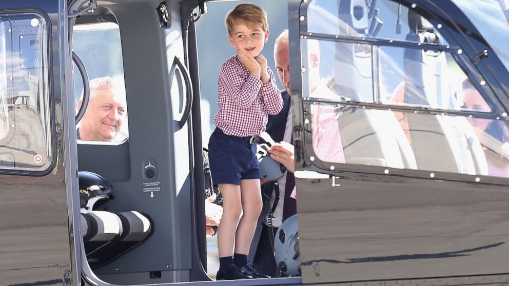 Prince William and Prince George view helicopter models H145 and H135 before departing from the Hamburg Airport on the last day of their official visit to Poland and Germany, July 21, 2017, in Hamburg, Germany. 