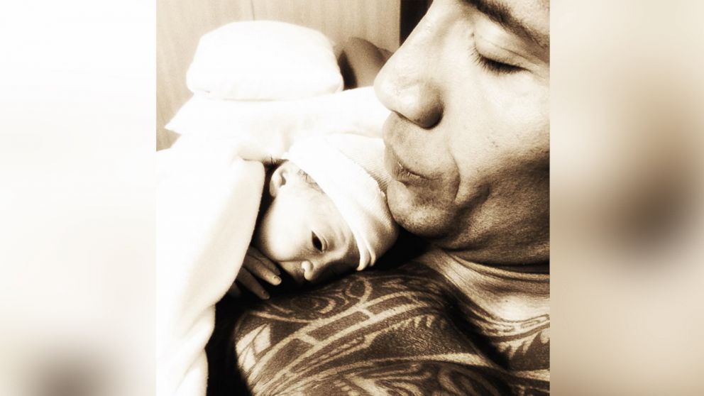 This image was posted to Dwayne "The Rock" Johnson's Instagram account on Dec. 20, 2015 with the text, "Christmas came early! Within minutes of being born she was laying on daddy's chest."