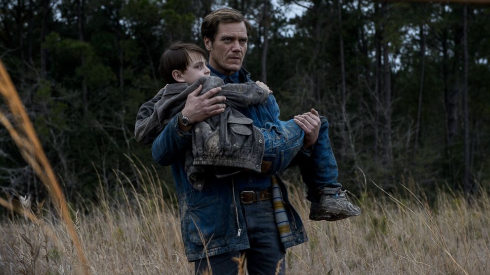 Jaeden Lieberher as Alton and Michael Shannon as Roy in a scene from the sci-fi thriller, "Midnight Special." 