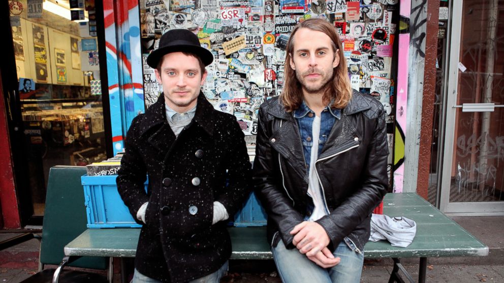 Elijah Wood, left, and Zach Cowie, right, are pictured in front of A1 Records in New York City on Jan. 19, 2015. 