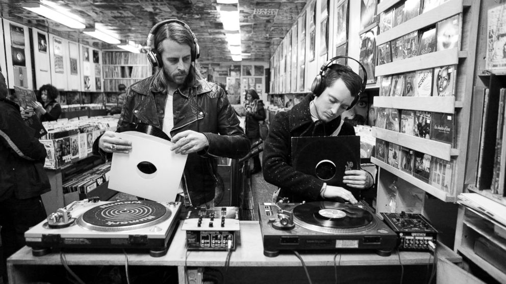 PHOTO: Zach Cowie, left, and Elijah Wood, right, try out vinyl records in A1 Records in New York City on Jan. 19, 2015. 