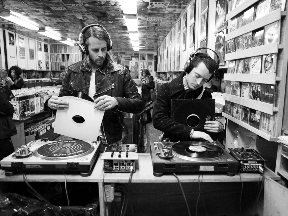 PHOTO: Zach Cowie, left, and Elijah Wood, right, try out vinyl records in A1 Records in New York City on Jan. 19, 2015.