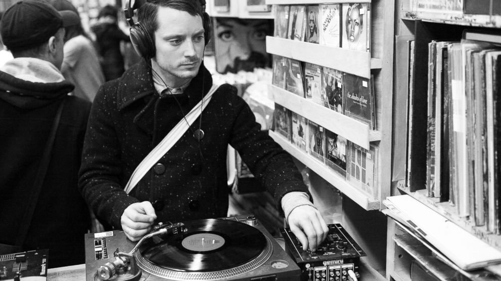 PHOTO: Elijah Wood is pictured listening to a vinyl record at A1 Records in New York City on Jan. 19, 2015. 