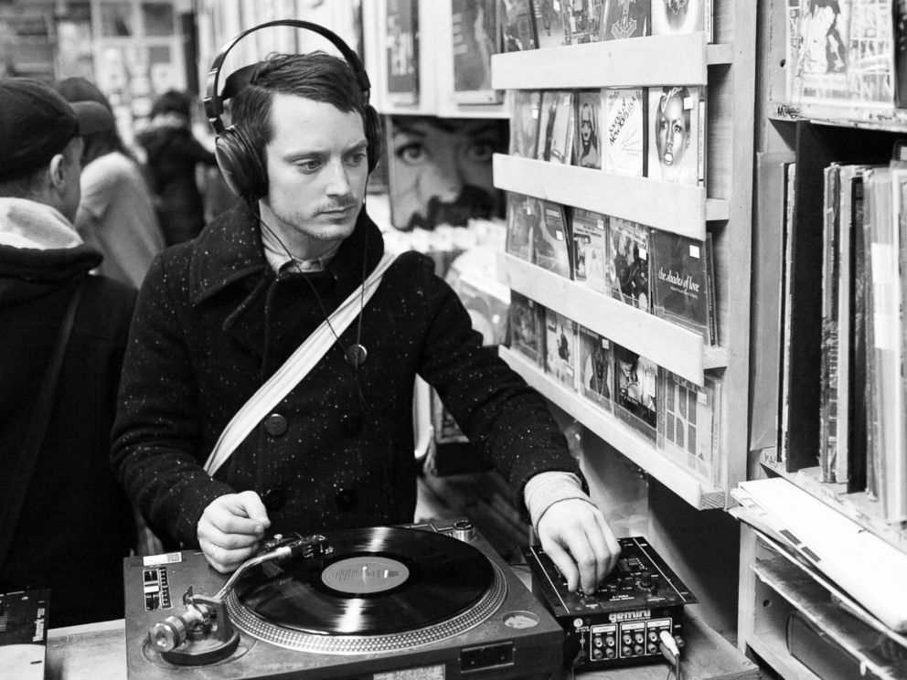 PHOTO: Elijah Wood is pictured listening to a vinyl record at A1 Records in New York City on Jan. 19, 2015.