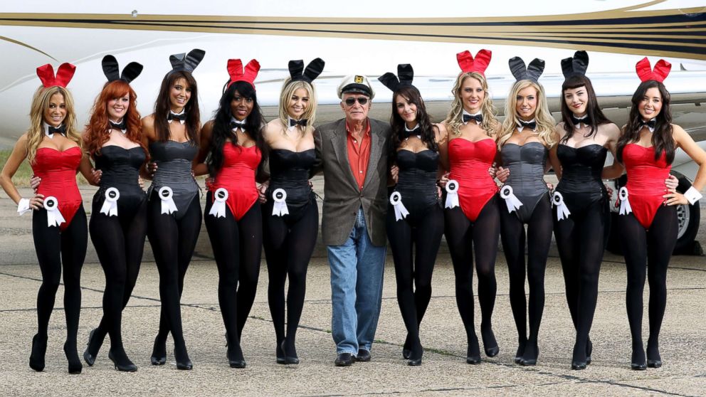 PHOTO: Playboy founder Hugh Hefner (centre) arrives at Stansted Airport, June 2, 2011, in Stansted, England.