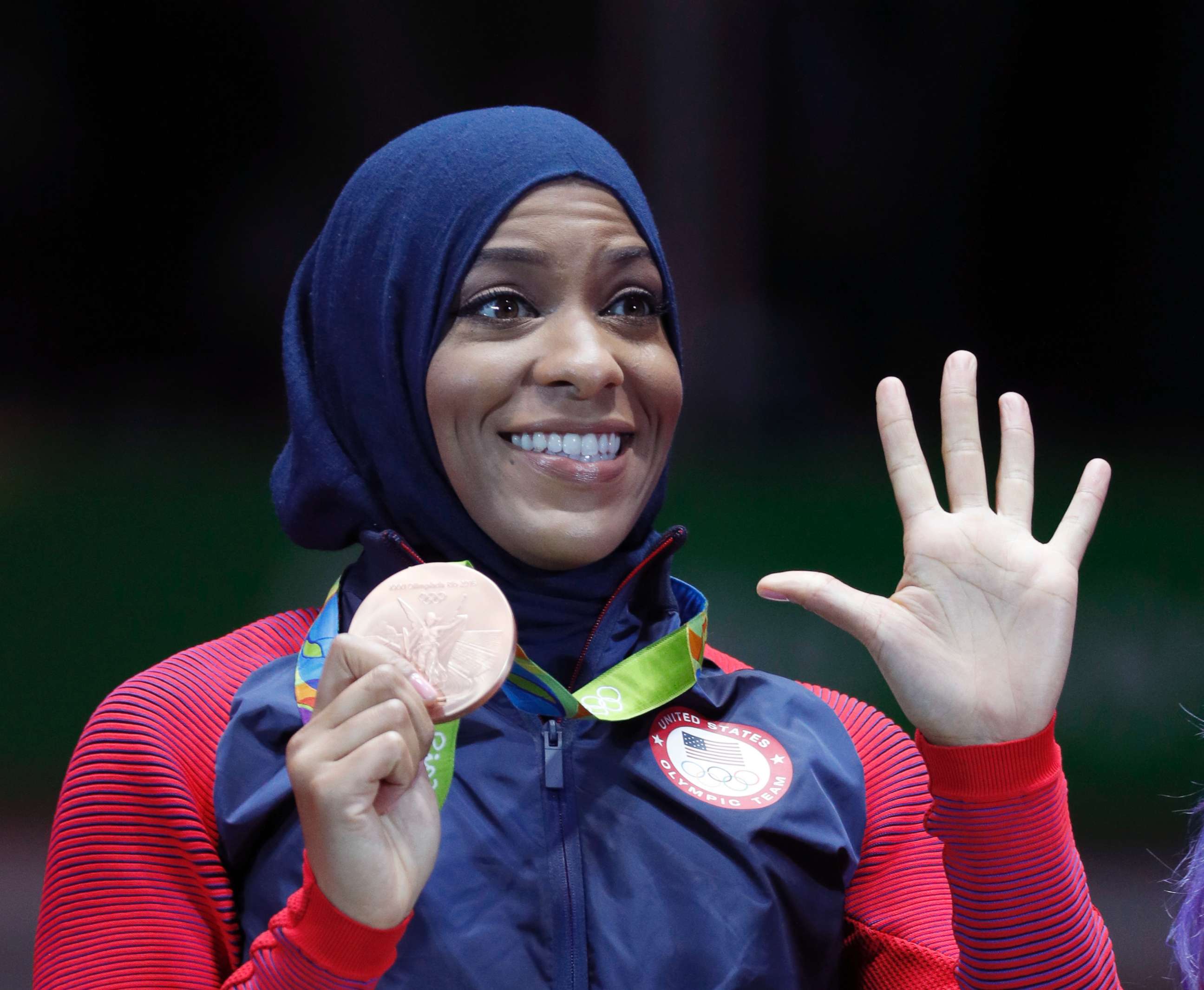 PHOTO: Ibtihaj Muhammad of the U.S. pose with her bronze medals on the podium after the women's team sabre fencing event at the 2016 Summer Olympics, in Rio de Janeiro, Brazil, Aug. 13, 2016.