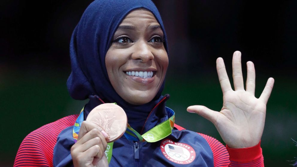 PHOTO: Ibtihaj Muhammad of the U.S. pose with her bronze medals on the podium after the women's team sabre fencing event at the 2016 Summer Olympics, in Rio de Janeiro, Brazil, Aug. 13, 2016.