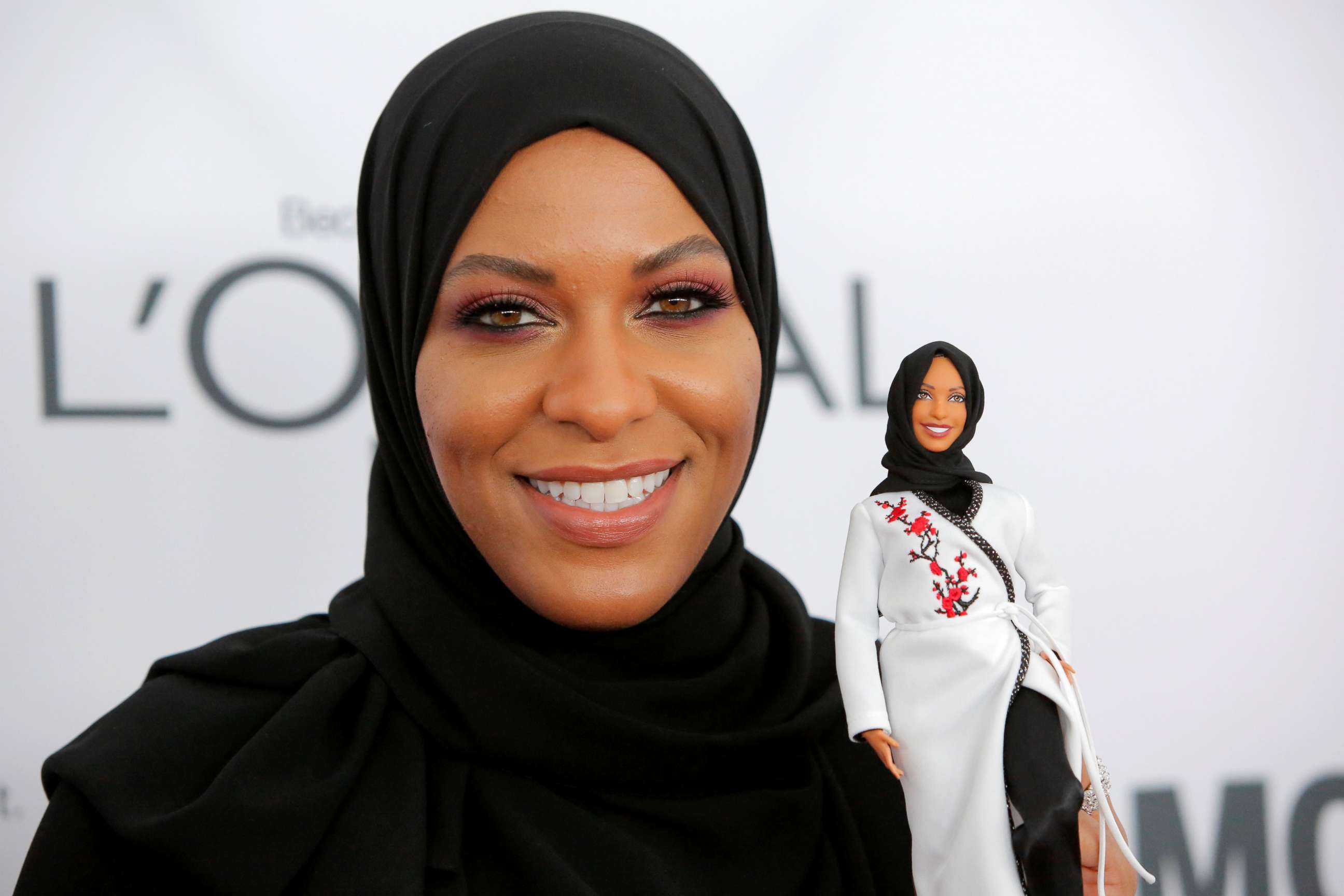 PHOTO: Olympic fencer Ibtihaj Muhammad holds a Barbie doll made in her likeness as she attends the 2017 Glamour Women of the Year Awards at the Kings Theater in Brooklyn, New York, Nov. 13, 2017. 