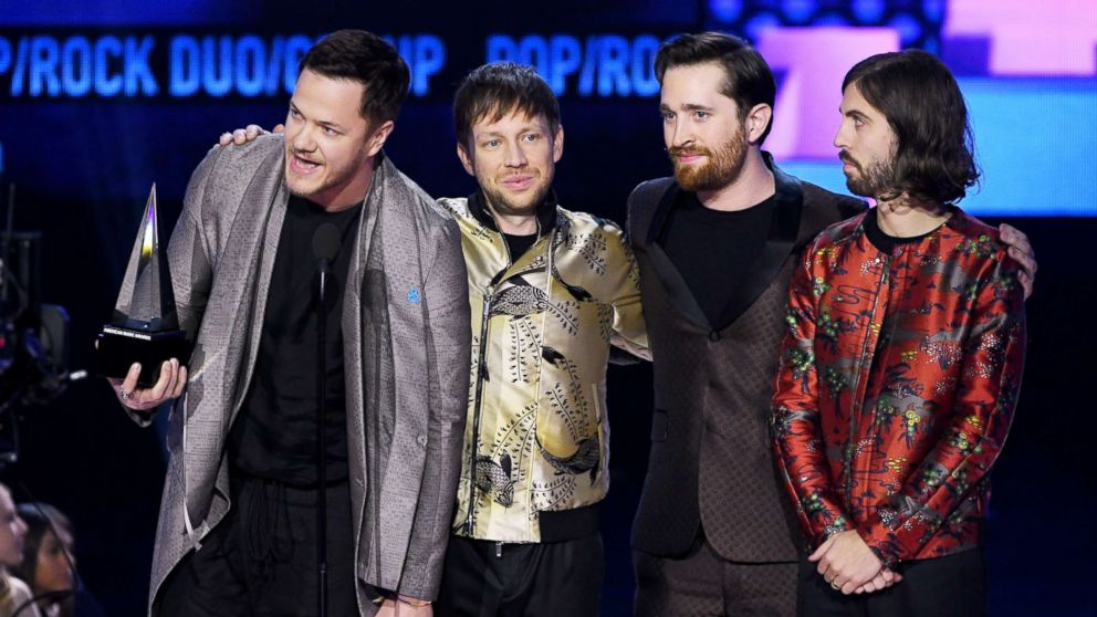 Dan Reynolds, Ben McKee, Daniel Platzman, and Wayne Sermon of Imagine Dragons accept the American Music Award onstage at Microsoft Theater, Nov. 19, 2017, in Los Angeles.