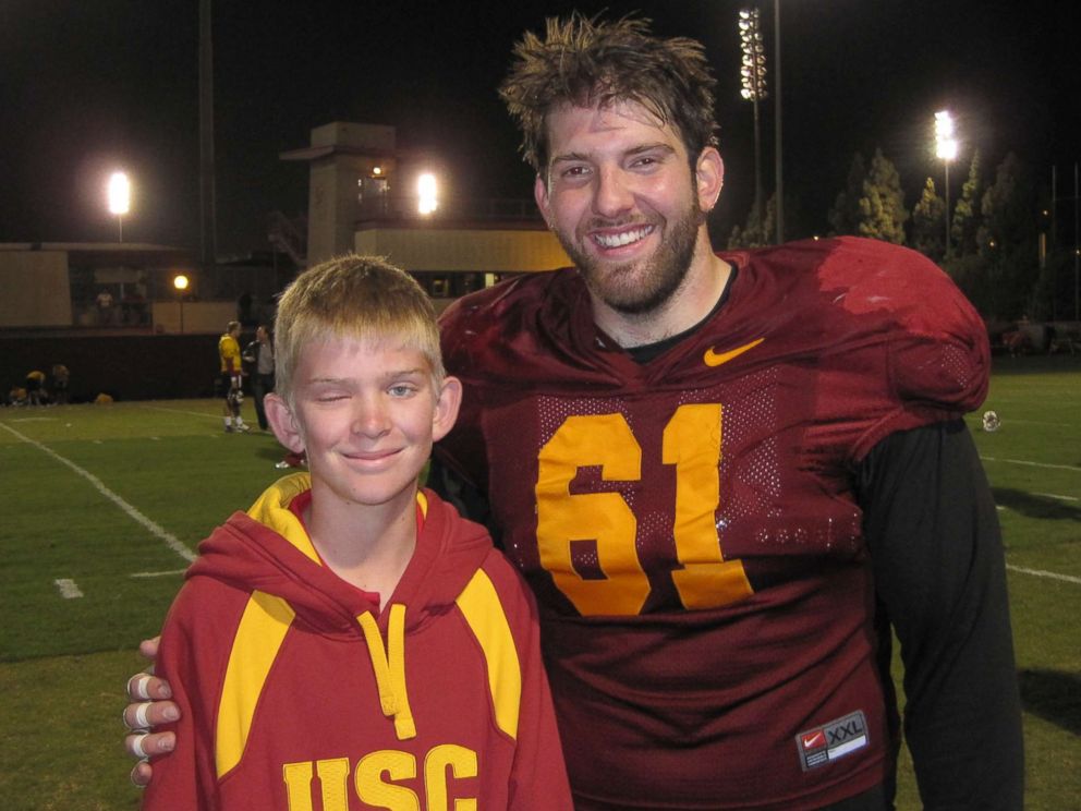 PHOTO: Jake Olson poses for a photo with former USC Trojan Kris O'Dowd in an undated family photo from a visit when Olson was a youngster.
