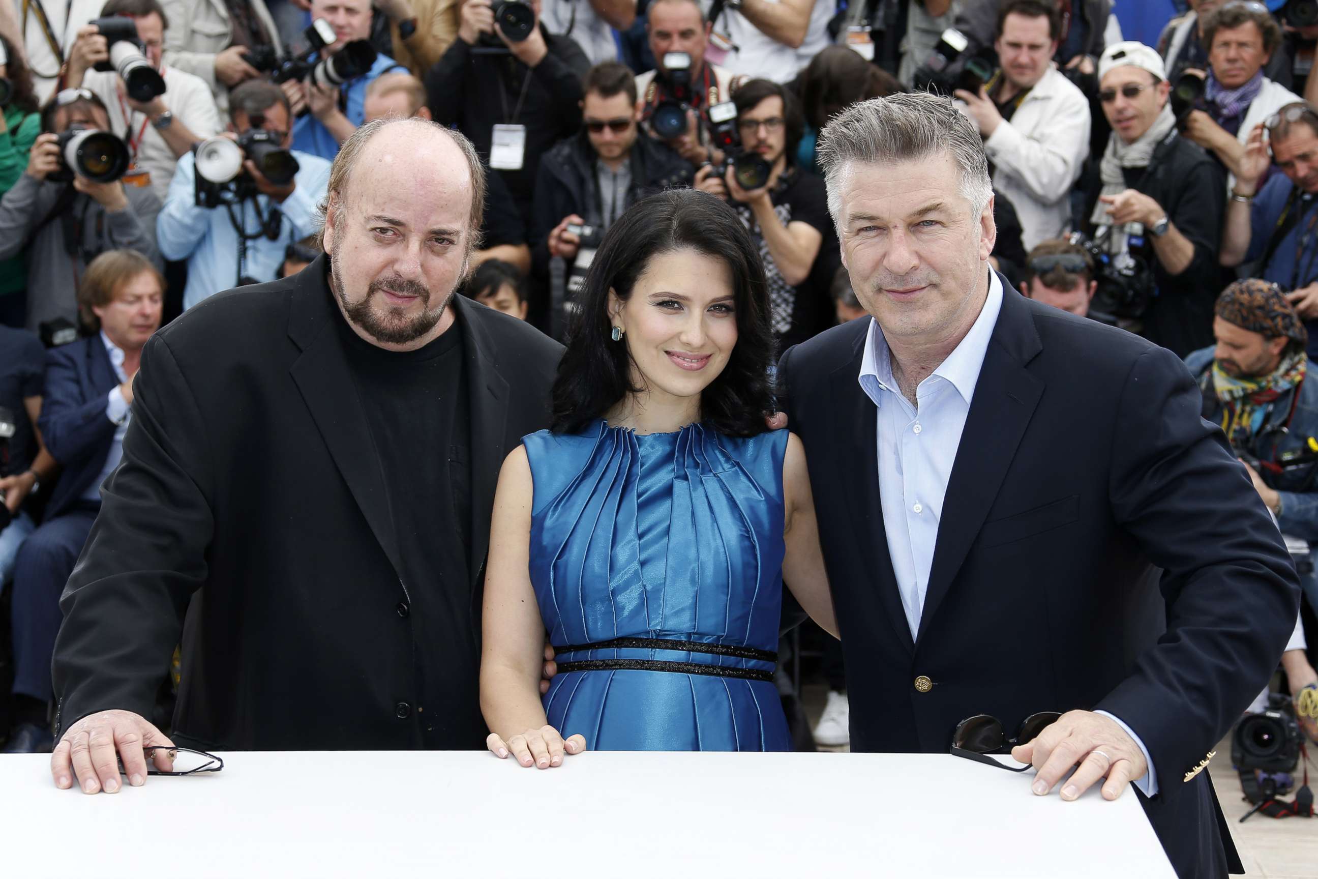 PHOTO: Alec Baldwin (R) poses with his wife Hilaria Thomas (C) and director James Toback during a photocall for the film 'Seduced and Abandoned' at the 66th edition of the Cannes Film Festival in Cannes, May 21, 2013. 