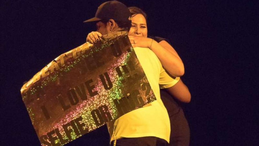 Christina Cruz, of San Jose, Calif., hugs Jay-Z during his latest tour stop of his 4:44 Tour in Oakland.