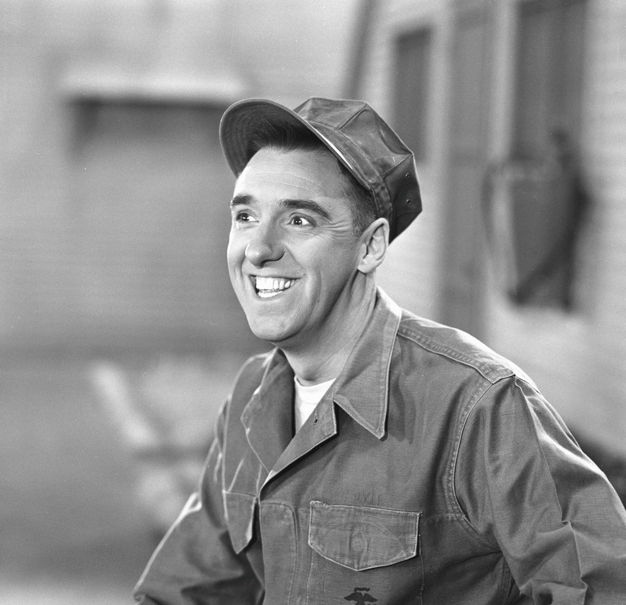 PHOTO: Actor Jim Nabors grins in a scene from an episode of the television comedy series 'Gomer Pyle, USMC' called 'Dance, Marine, Dance,' Sept. 30, 1964.