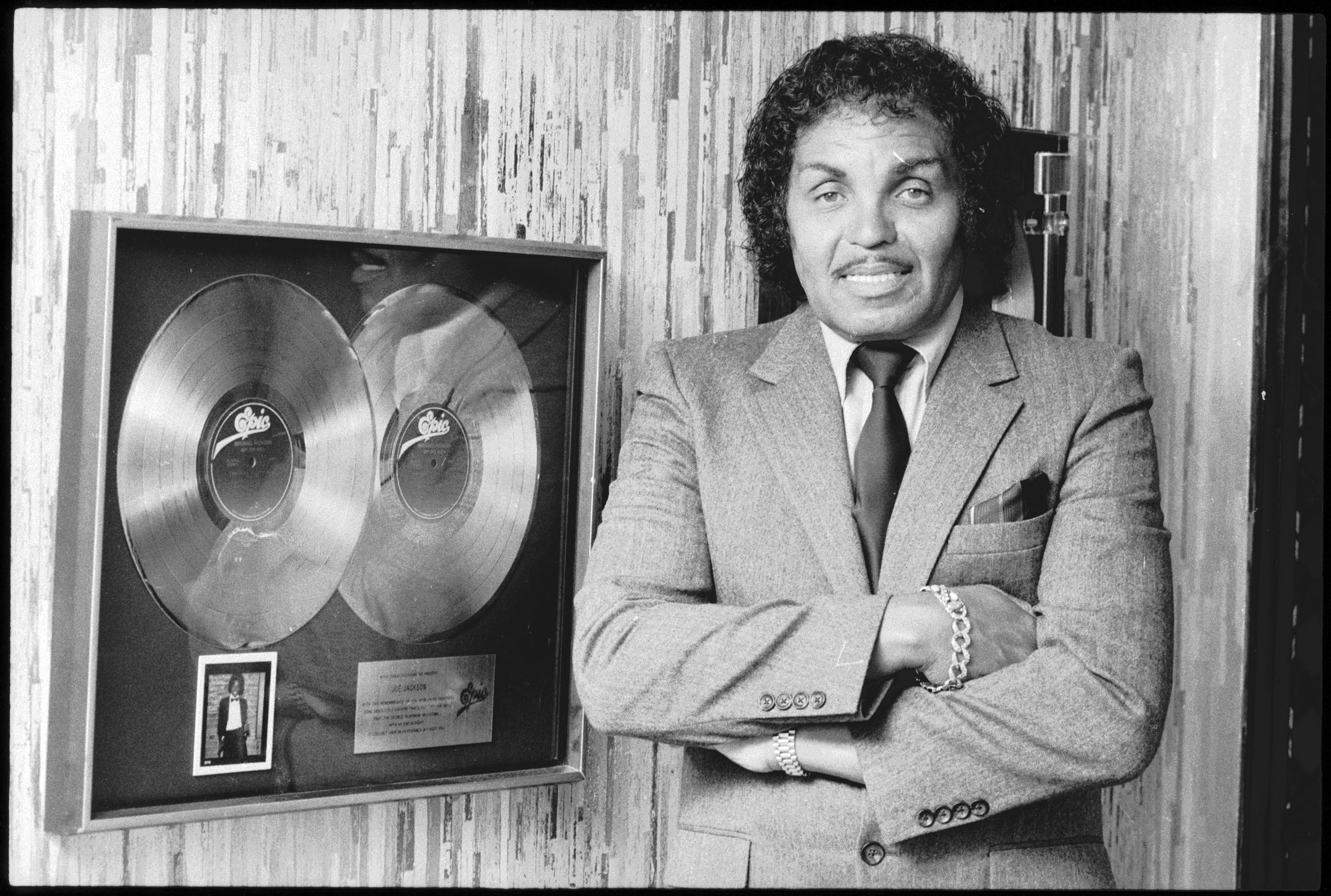 PHOTO: In this file photo, Joseph Jackson, father and manager of The Jackson Five, poses by an Epic double platinum award, circa 1982.