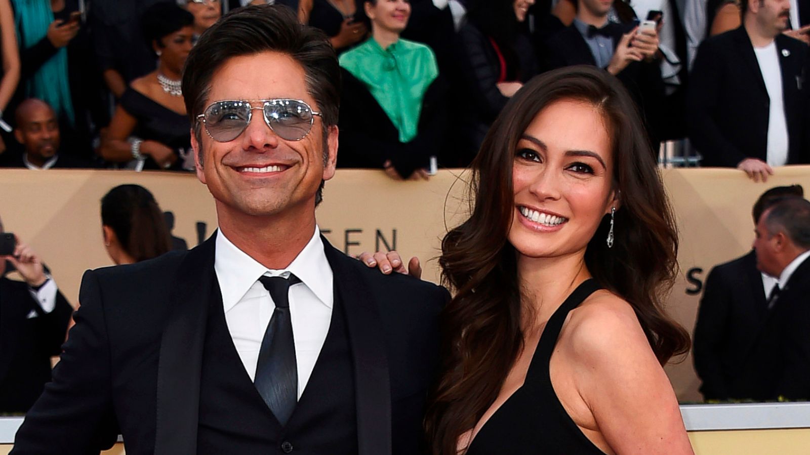 John Stamos, left, and Caitlin McHugh arrive at the Screen Actors Guild Awards on Jan. 21, 2018. Stamos announced on Instagram the birth of his son, Billy Stamos.