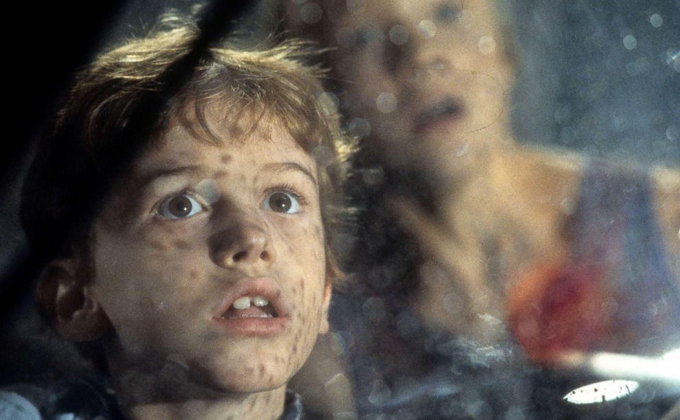 PHOTO: Joseph Mazzello and Ariana Richards look out a window in a scene from the film 'Jurassic Park', 1993.