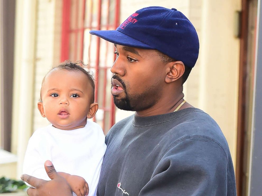 PHOTO: Kanye West holds his son Saint West on a walk in Soho in New York City on October 6, 2016.