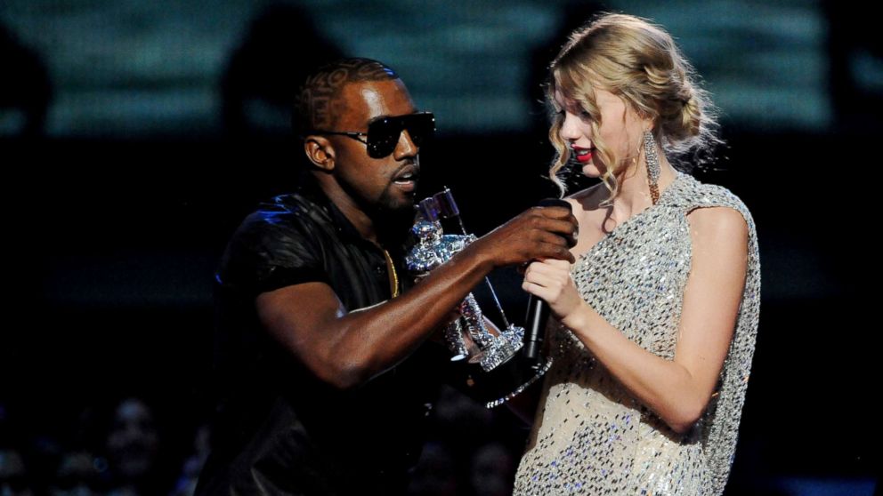 Kanye West jumps onstage after Taylor Swift won the "Best Female Video" award during the 2009 MTV Video Music Awards at Radio City Music Hall, Sept. 13, 2009, in New York. 