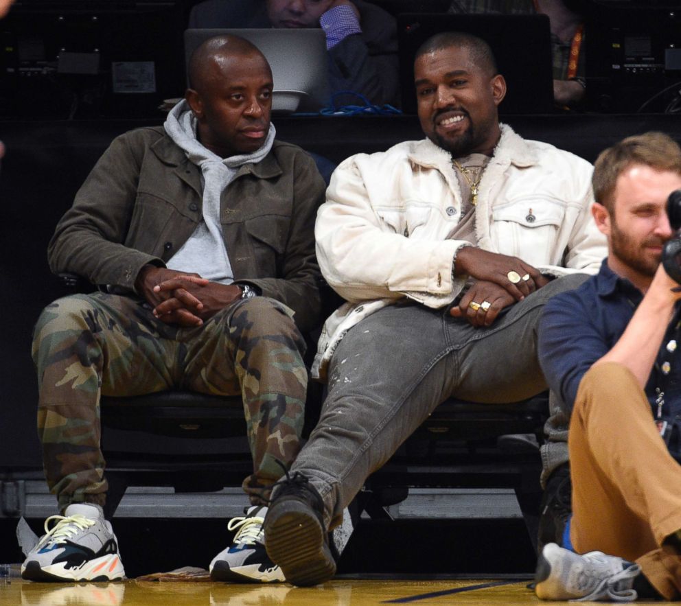 PHOTO: Rapper Kanye West, right, attends the Los Angeles Lakers vs. Memphis Grizzlies basketball game at Staples Center on November 5, 2017, in Los Angeles.