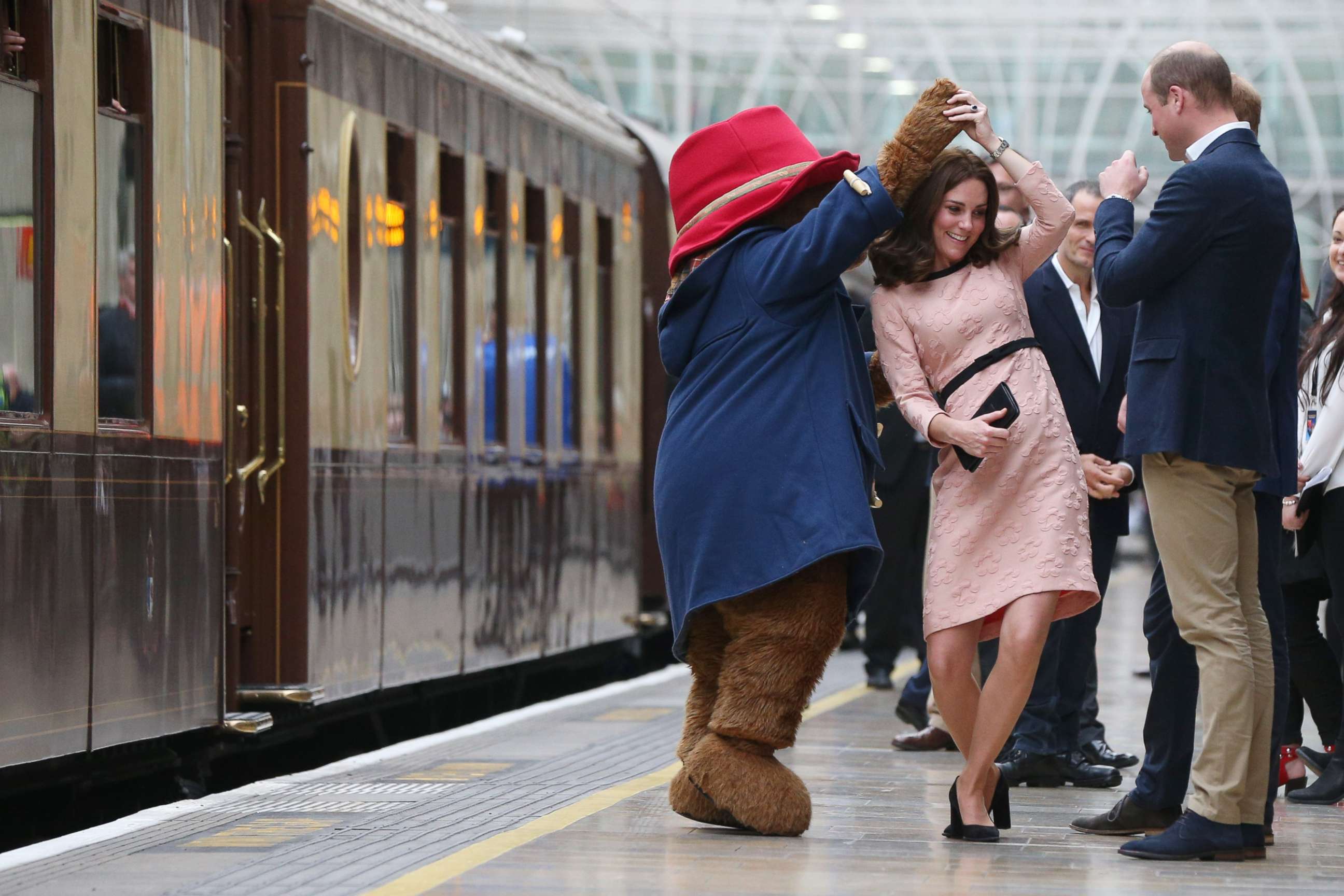 PHOTO: Catherine, Duchess of Cambridge dances with Paddington bear on platform 1 at Paddington Station as she meets the cast and crew from the forthcoming film Paddington 2 at Paddington Station on Oct. 16, 2017.