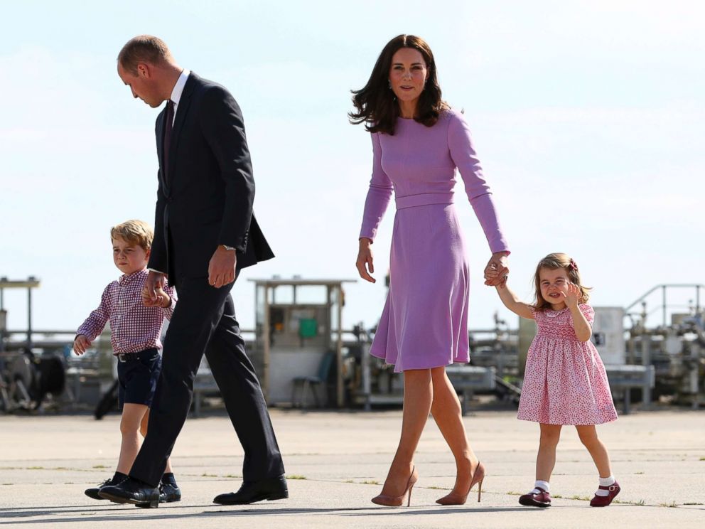 PHOTO: Britains Prince William and his wife Kate, the Duchess of Cambridge, and their children, Prince George and Princess Charlotte, are pictured before boarding a plane in Hamburg, Germany, July 21, 2017.