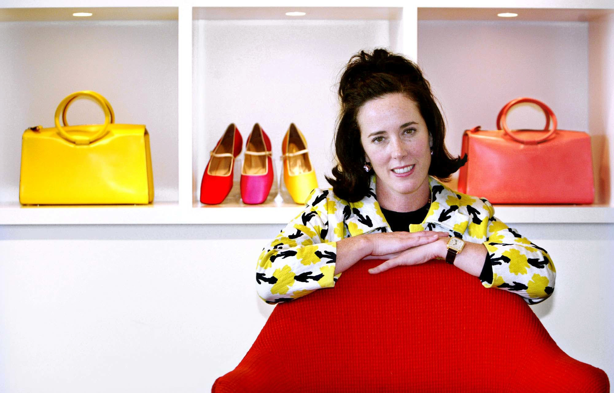 PHOTO: In this May 13, 2004 file photo, designer Kate Spade poses with handbags and shoes from her next collection in New York.