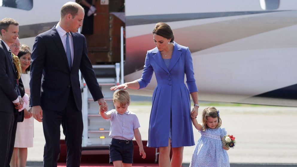 PHOTO: Prince William, the Duke of Cambridge and Catherine, The Duchess of Cambridge and their children Prince George and Princess Charlotte arrive at the Tegel airport in Berlin, July 19, 2017.