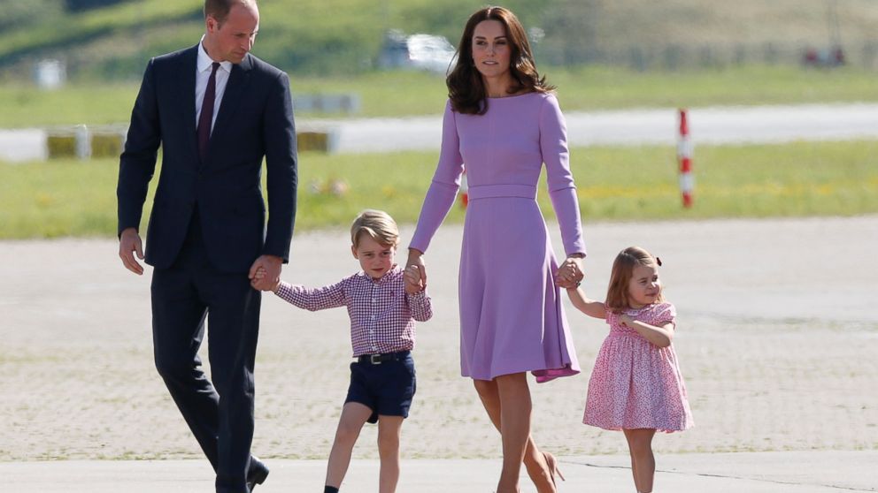 PHOTO: Prince William and Catherine, Duke and Duchess of Cambridge, with children Prince George and Princess Charlotte look at helicopters before leaving to go home after their five days tour of Poland and Germany, July 21, 2017, in Hamburg, Germany.