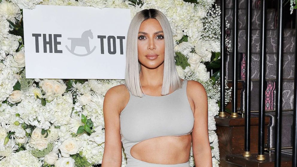 Kim Kardashian is facing backlash on social media after posting a topless photo that was apparently taken by her 4-year-old daughter.