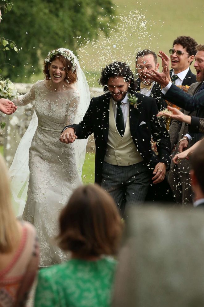 PHOTO: Kit Harington and Rose Leslie react as they leave after their wedding ceremony at Rayne Church, Kirkton of Rayne in Aberdeenshire, Scotland, June 23, 2018.