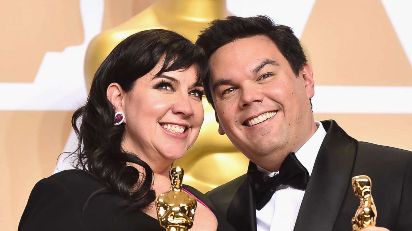 PHOTO: Composers Kristen Anderson-Lopez and Robert Lopez, winners of the Best Original Song award for 'Remember Me' from 'Coco,' pose in the press room during the 90th Annual Academy Awards, March 4, 2018, in Hollywood, Calif.