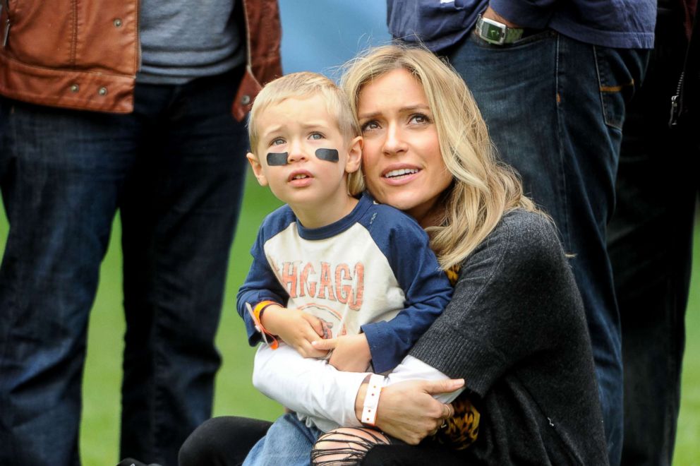 PHOTO: Kristin Cavallari holds her son Camden prior to the start of the Chicago Bears versus the Oakland Raiders game at Soldier Field, Oct. 4, 2015, in Chicago.