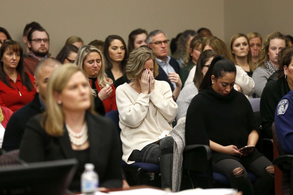 PHOTO: In this file photo, people in the courtroom react as former Michigan State University and USA Gymnastics doctor Larry Nassar listens during impact statements during the sentencing phase, Jan. 24, 2018, in Lansing, Mich.
