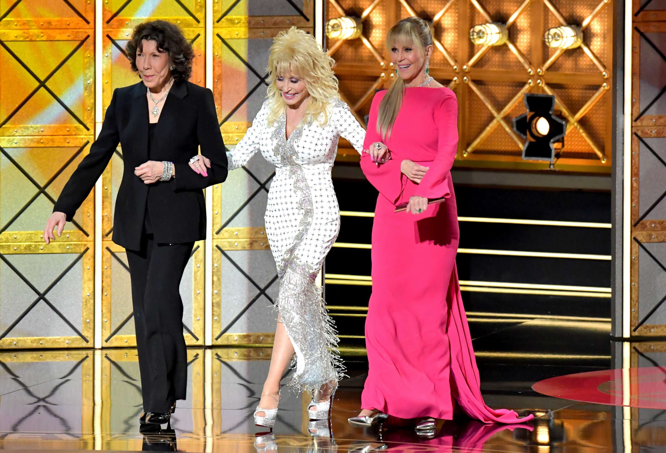PHOTO: Actors  Lily Tomlin, Dolly Parton, and Jane Fonda speak onstage during the 69th Annual Primetime Emmy Awards at Microsoft Theater, Sept. 17, 2017, in Los Angeles.
