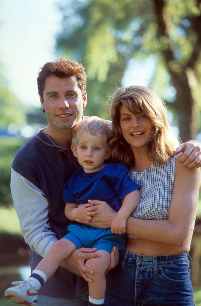 PHOTO: John Travolta and Kirstie Alley holding a child in a scene from the film "Look Who's Talking," 1989. 