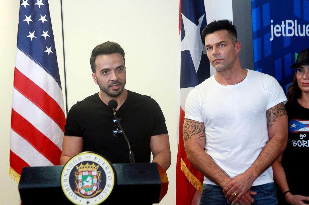 PHOTO: Luis Fonsi talks to media while Ricky Martin listens during the press conference supporting victims of Hurricane Maria at Luis Munoz Marin International Airport on Oct. 2, 2017, in San Juan, Puerto Rico.  
