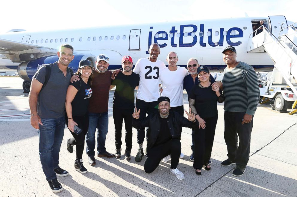 PHOTO: Singer Luis Fonsi, fourth from left, and other celebrities gather before departing Luis Munoz Marin  International Airport in San Juan, Puerto Rico, Oct. 03, 2017.