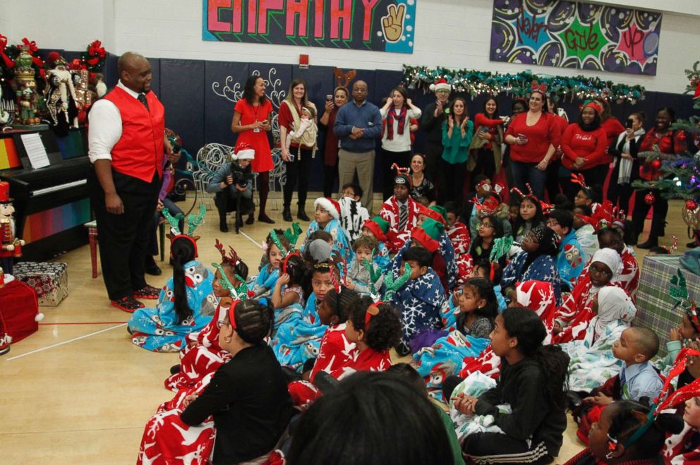 PHOTO: Children gathered around to hear a song from Major Attaway, who plays Genie in Disney's "Aladdin" on Broadway. 