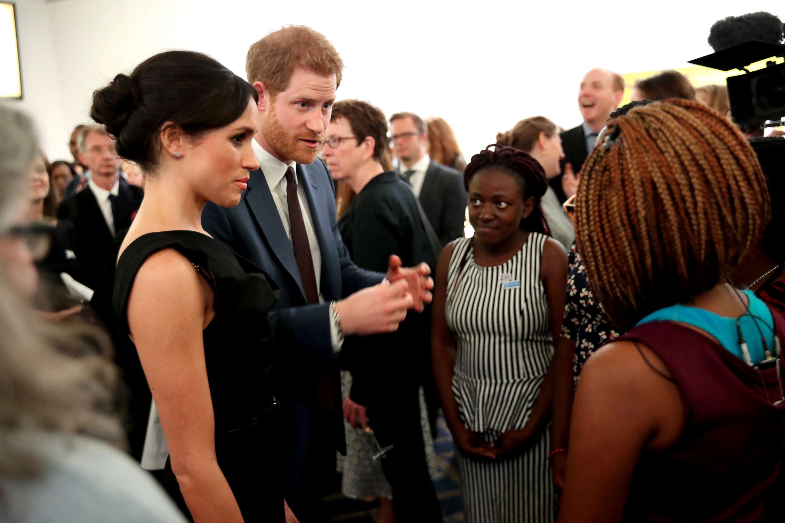 PHOTO: Meghan Markle and Prince Harry speaks with guests as they attend the Women's Empowerment reception at the Royal Aeronautical Society, April 19, 2018, in London.