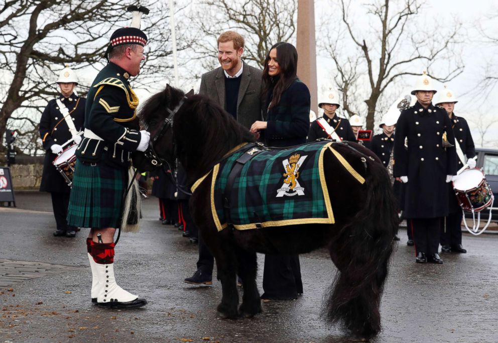 PHOTO: Britain's Prince Harry and Meghan Markle meet Pony Major Mark Wilkinson and regimental mascot Cruachan IV on the esplanade at Edinburgh Castle, Scotland, Feb. 13, 2018.