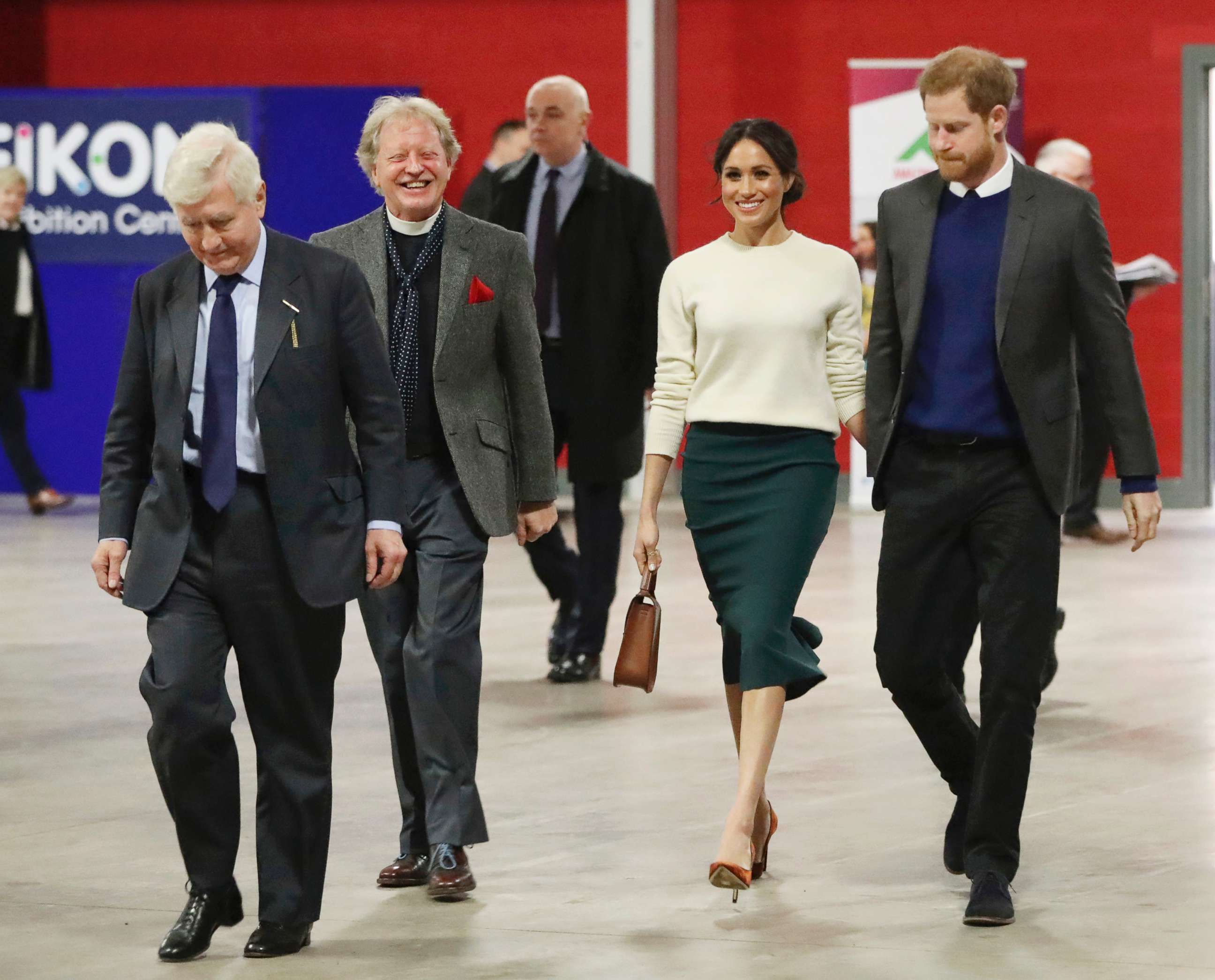 PHOTO: The Reverend Dr. David Latimer, second left, walks with Meghan Markle and Britain's Prince Harry as they arrive for a visit to the Eikon Exhibition Centre in Lisburn, Northern Ireland, March 23, 2018. 