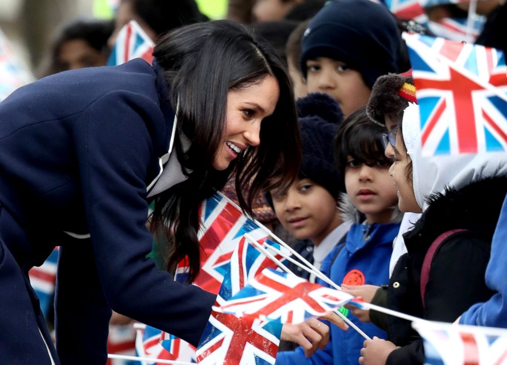 PHOTO: Meghan Markle talks to children as she arrives to Birmingham, March 8, 2018, in Birmingham, England.